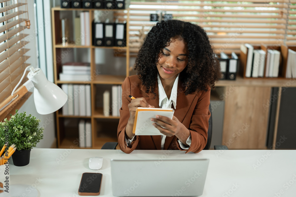 Portrait of a young businesswoman thinking work concept sitting at desk in the office.