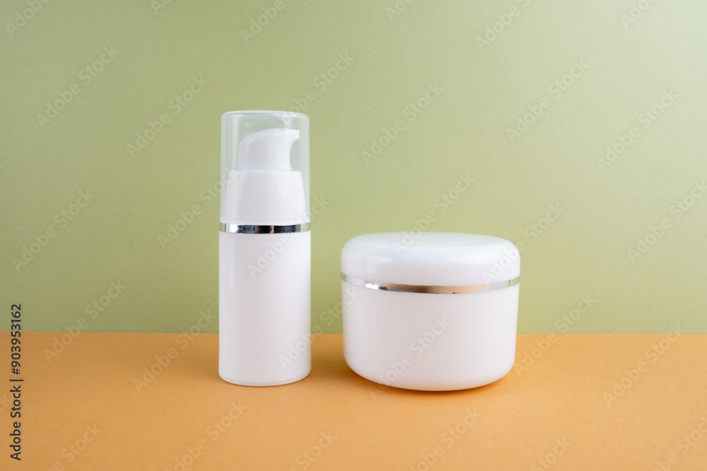 Container for cream, shampoo, toiletries, spa. Unbranded white plastic bottles. Bottle with a dispenser for cosmetic products. Skin care and beauty concept. Mockup style, copy space Container for cream, shampoo, toiletries, spa. Unbranded white plastic bottles. Bottle with a dispenser for cosmetic products. Skin care and beauty concept. Mockup style, copy space