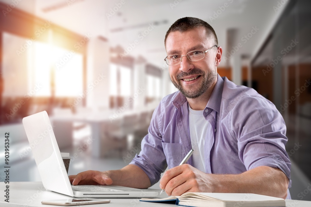 Portrait of mature business man trader in office