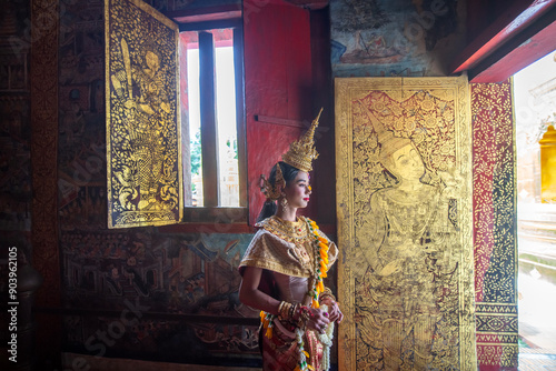 A young Thai dressed in a beautiful pantomime dressed.Khon is traditional dance drama art of Thai classical masked. photo