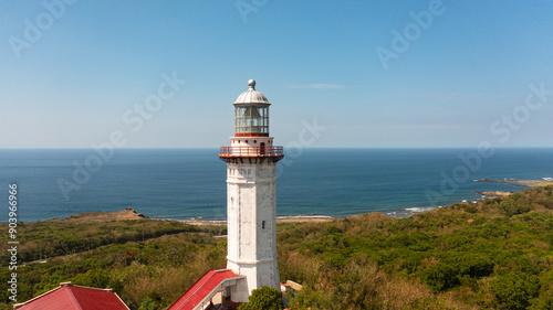 Aerial view of lighthouse on hill. Cape Bojeador Lighthouse, Ilocos Norte, Philippines. photo