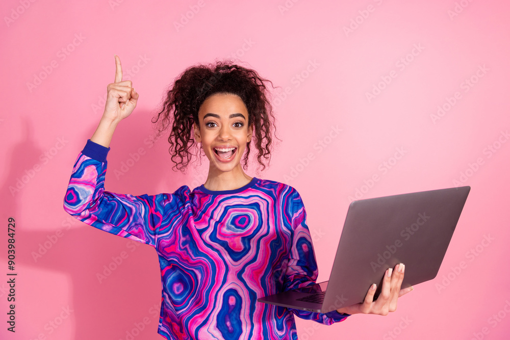 Photo of excited positive woman wear print sweatshirt pointing finger up typing modern gadget isolated pink color background Photo of excited positive woman wear print sweatshirt pointing finger up typing modern gadget isolated pink color background