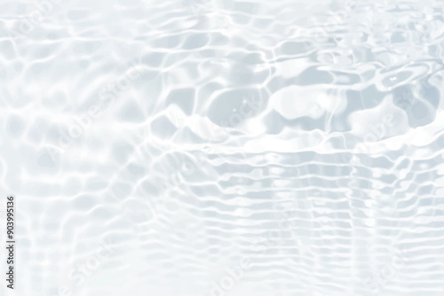 White water with ripples on the surface. Defocus blurred transparent white colored clear calm water surface texture with splashes and bubbles. Water waves with shining pattern texture background.