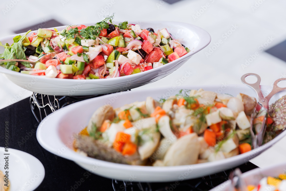 Variety of Mediterranean dishes served on a buffet table Variety of Mediterranean dishes served on a buffet table