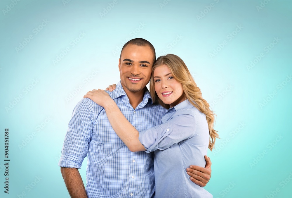 Young happy couple standing and hugging Young happy couple standing and hugging