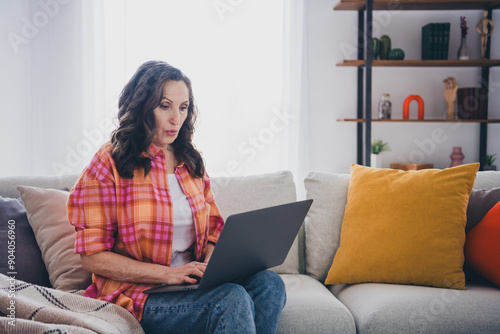 Photo of impressed cheerful lady wear plaid shirt online shopping modern device indoors room home house