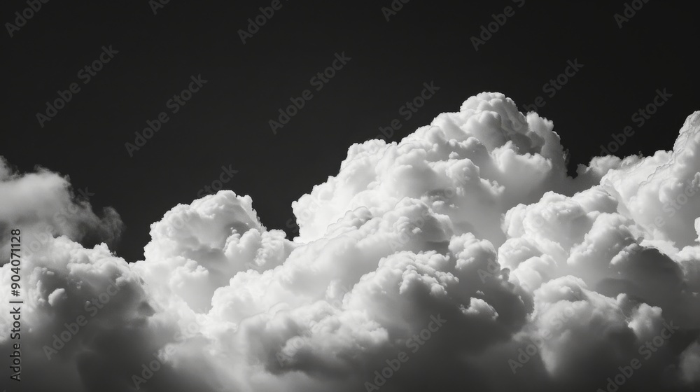 White fluffy clouds set against a stark black background White fluffy clouds set against a stark black background