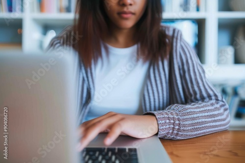 closeup shot of an unrecognisable woman using a laptop at home photo