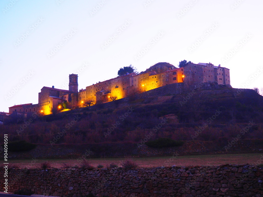 Fototapeta premium Culla, a village in Maestrazgo, Castellón, illuminated at dusk
