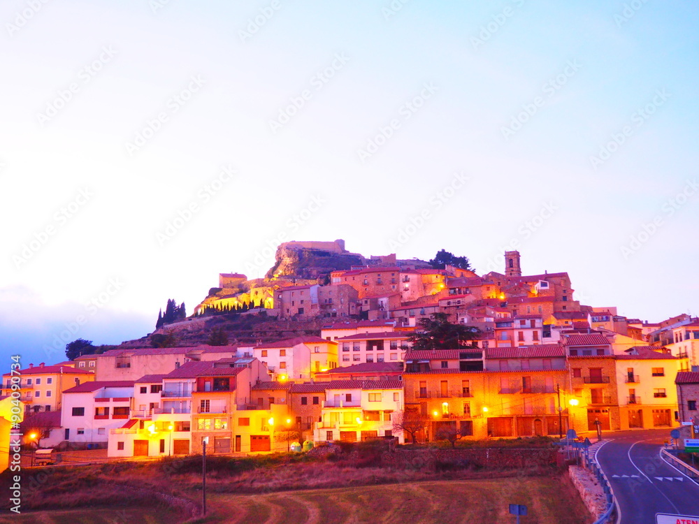 Obraz premium Culla, a village in Maestrazgo, Castellón, illuminated at dusk