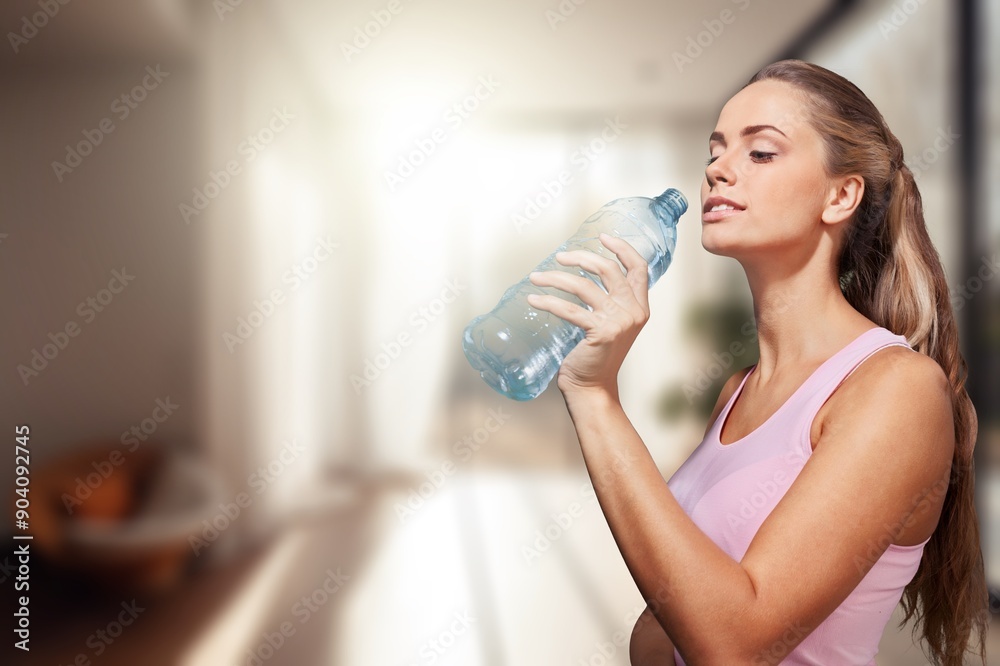 Happy young sporty woman Drinking water after fitness Happy young sporty woman Drinking water after fitness