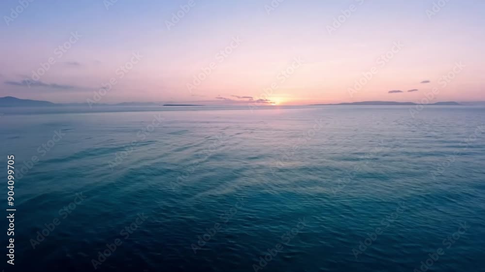 The Beauty of Twilight at Sea: Calm Sea Surface at Sunset footage The Beauty of Twilight at Sea: Calm Sea Surface at Sunset footage