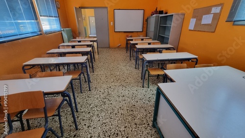 class of elemantary school desk chairs board empty photo