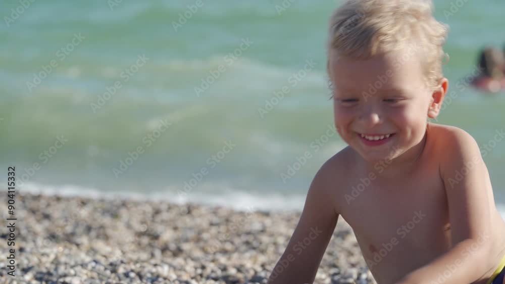Children playing on the beach. Happy child buried in sand. Children summer vacation. Yevpatoriya, Crimea, Russia 2024 Children playing on the beach. Happy child buried in sand. Children summer vacation. Yevpatoriya, Crimea, Russia 2024