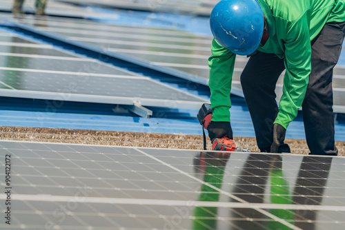Wallpaper Mural Worker Technicians are working to construct solar panels system on roof. Installing solar photovoltaic panel system. Men technicians walking on roof structure to check photovoltaic solar modules. Torontodigital.ca