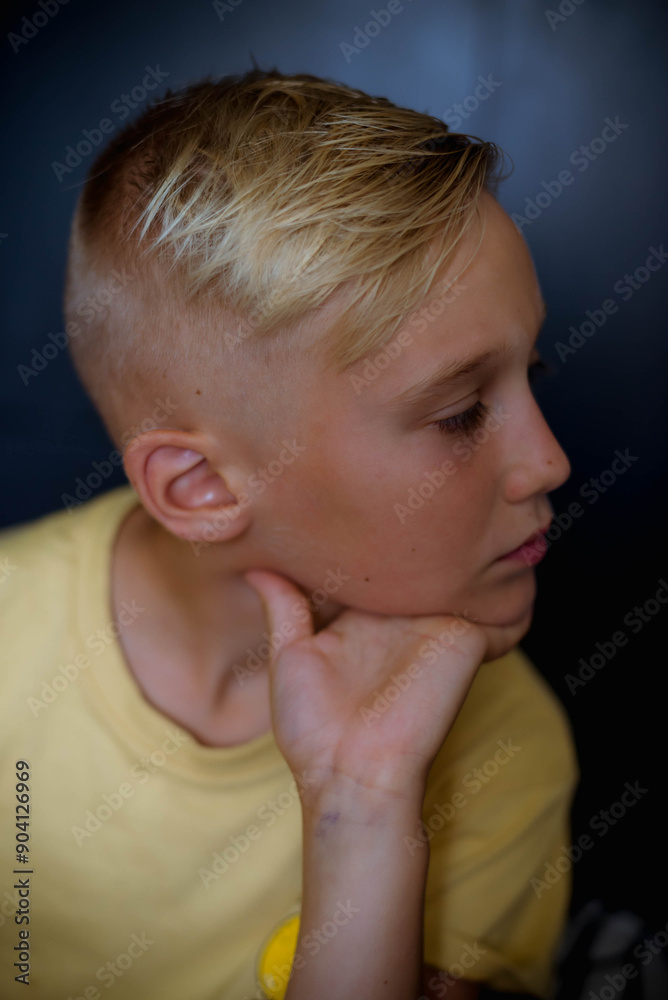 handsome blond boy posing for the camera handsome blond boy posing for the camera