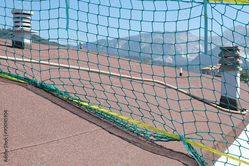 Safety net. Roof safety net.Satellite dish on a roof with a fall protection net for construction work. 