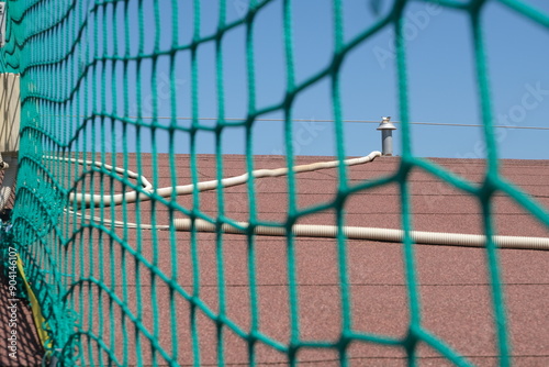Fall arrest devices. Roof fall arrest devices.Lifeline cable and fall protection nets from the roof on a construction site. 