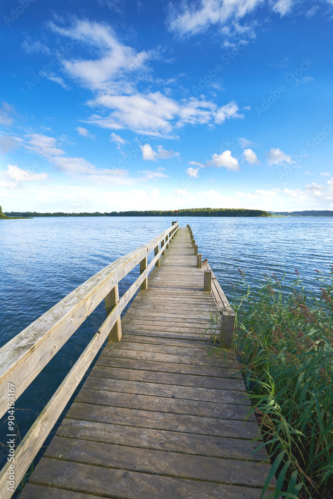 Lake, bridge and blue sky in nature and clouds, water or landscape with outdoor plants. Wood, platform or river in countryside or adventure and structure or path for journey and travel for holiday Lake, bridge and blue sky in nature and clouds, water or landscape with outdoor plants. Wood, platform or river in countryside or adventure and structure or path for journey and travel for holiday