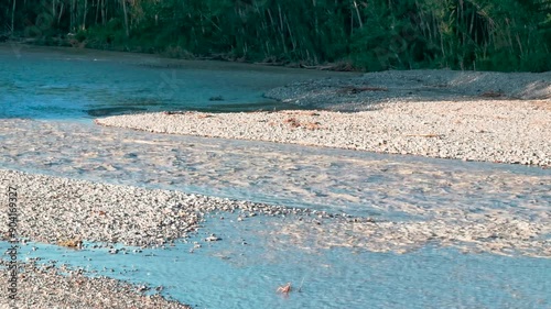 flood of the Enza river in Montecchio Emilia Italy at sunset. High quality 4k footage photo