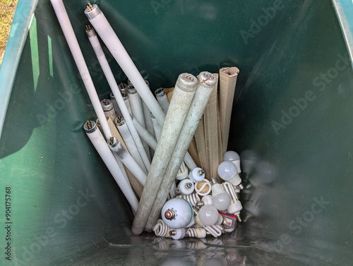Fotografie Used fluorescent lamps for recycling in the container bin