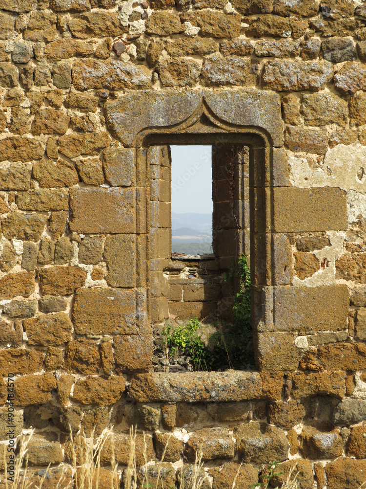 Castle of Polignac. 11th-16th century. Auvergne. France. Ruins of the walls with beautiful ogee window. Castle of Polignac. 11th-16th century. Auvergne. France. Ruins of the walls with beautiful ogee window.