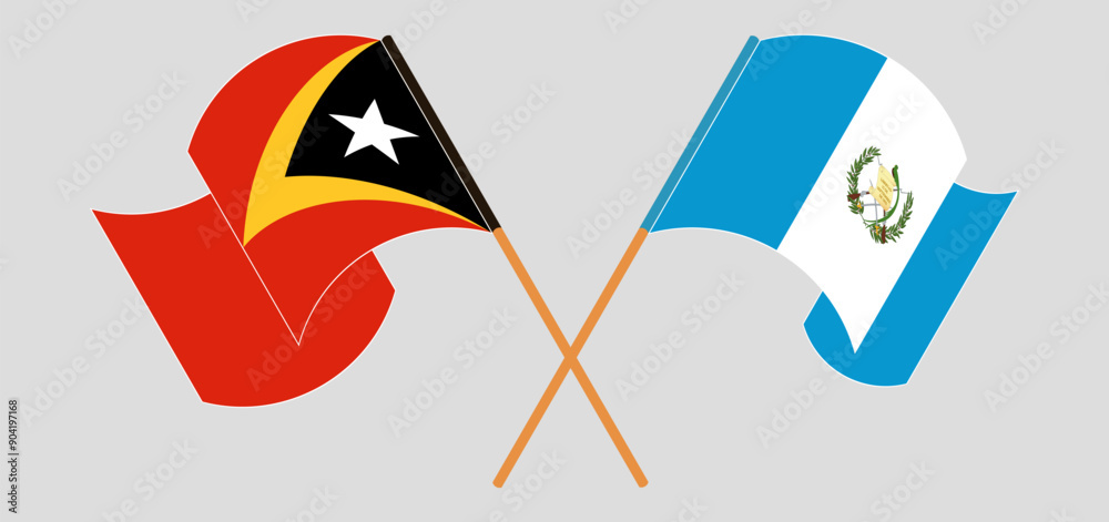 Crossed and waving flags of East Timor and Republic of Guatemala Crossed and waving flags of East Timor and Republic of Guatemala