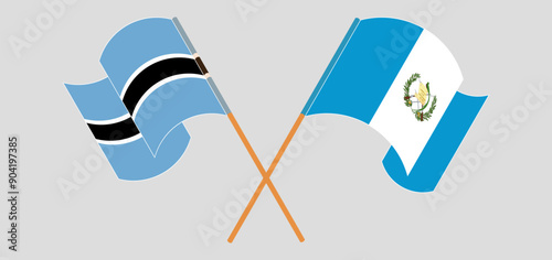 Crossed and waving flags of Botswana and Republic of Guatemala