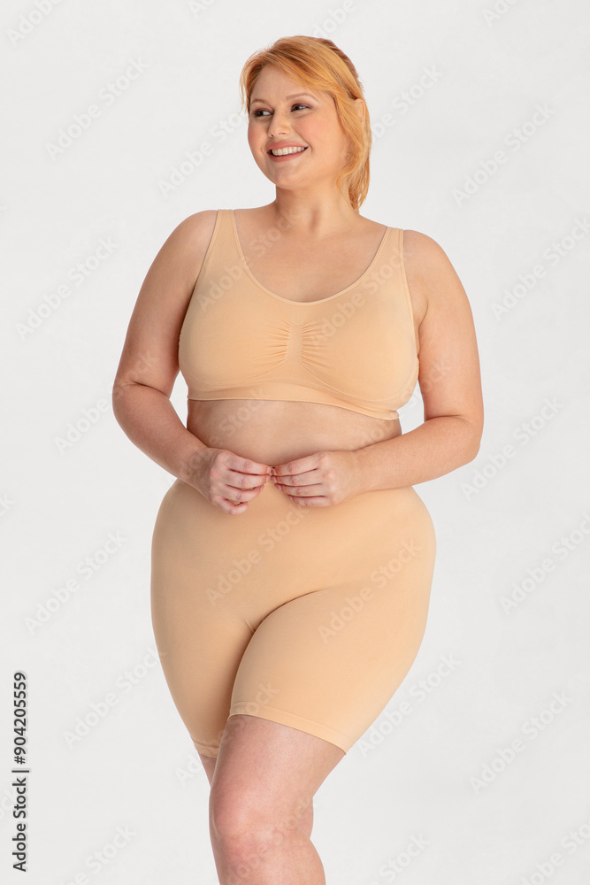 Portrait of a attractive young woman plus size in underwear model posing isolated on a white background mockup. White female, laughing and feeling confident. Clipping path. Body positivity - AI photo Portrait of a attractive young woman plus size in underwear model posing isolated on a white background mockup. White female, laughing and feeling confident. Clipping path. Body positivity - AI photo