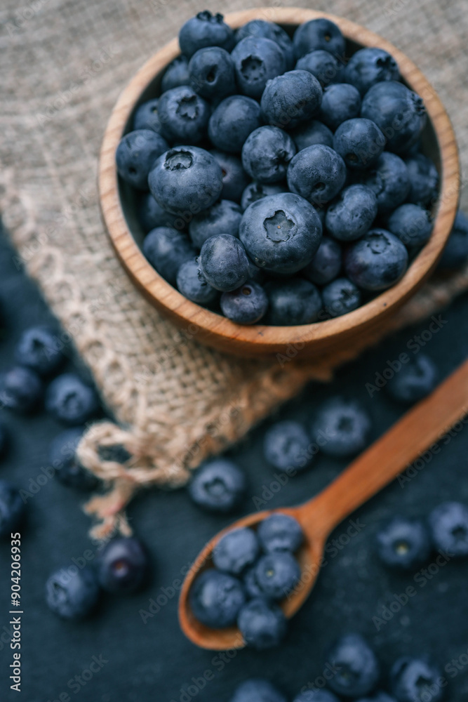 Blueberries background. Blueberry border design. Ripe and juicy fresh picked bilberries close up. Copyspace for your text Blueberries background. Blueberry border design. Ripe and juicy fresh picked bilberries close up. Copyspace for your text