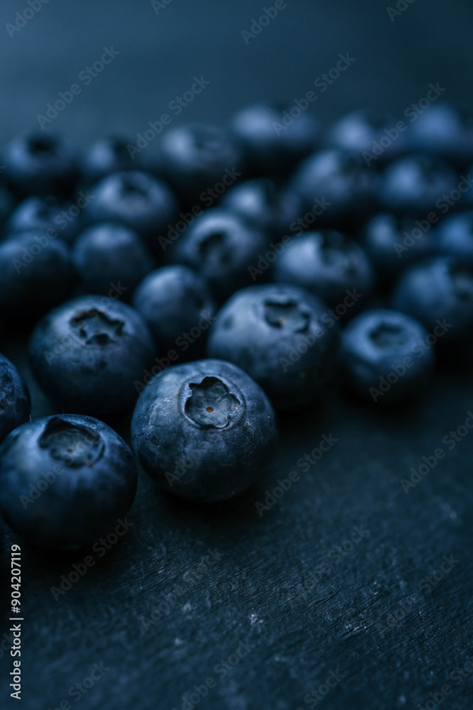 Blueberries background. Blueberry border design. Ripe and juicy fresh picked bilberries close up. Copyspace for your text Blueberries background. Blueberry border design. Ripe and juicy fresh picked bilberries close up. Copyspace for your text