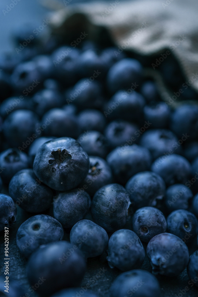Blueberries background. Blueberry border design. Ripe and juicy fresh picked bilberries close up. Copyspace for your text Blueberries background. Blueberry border design. Ripe and juicy fresh picked bilberries close up. Copyspace for your text