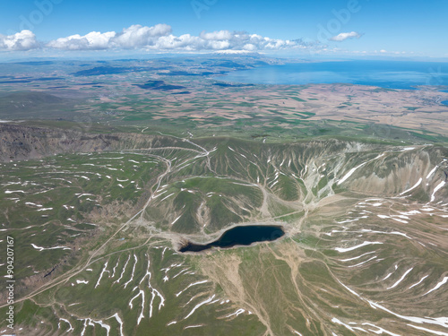 View of Nemrut Lake, the second largest crater lake in the world and the largest in Turkey, with Mount Suphan in the background photo