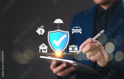 Insurance online agent solution concept, life, family, health, and financial technology. Businessman use tablet giving insurance and assurance icon, real estate, car and finance for risk management.