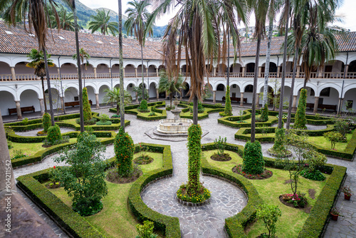 Quito, Pichincha, Ecuador - November 20, 2013: Interior patios and gardens of the San Francisco church and convent, on a sunny and overcast day.