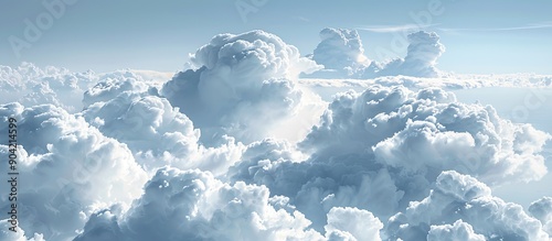 Fluffy white clouds blanket the sky resembling a heavenly backdrop perfect for wallpapers and textures portraying the concept of imaginative natural cloud formations with ample copy space image availa photo