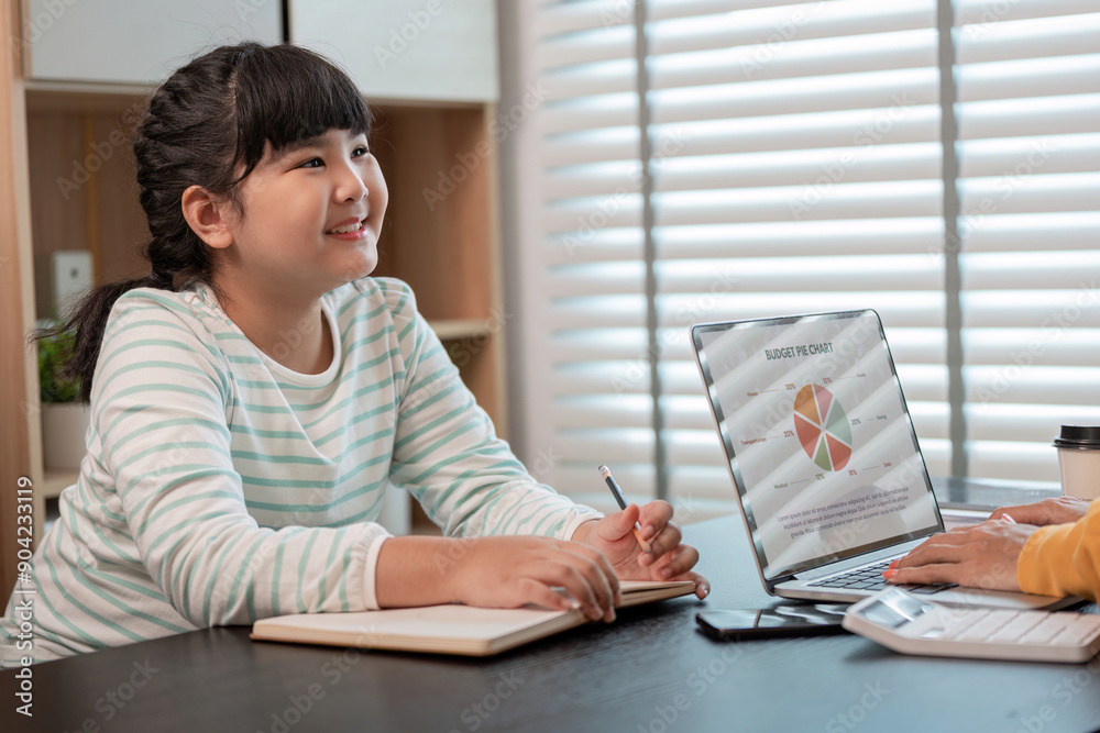 Mother and Child Working from Home Together in a Modern Home Office Setting with Laptop and Notebooks Mother and Child Working from Home Together in a Modern Home Office Setting with Laptop and Notebooks