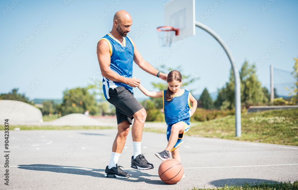 Obraz premium Basketball, sport with a dad and daughter training on a court outside for leisure fitness and fun