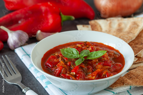 Traditional balkanic and mediterranean food  made with red bell pepper, tomato and onion.  Served with bread. photo