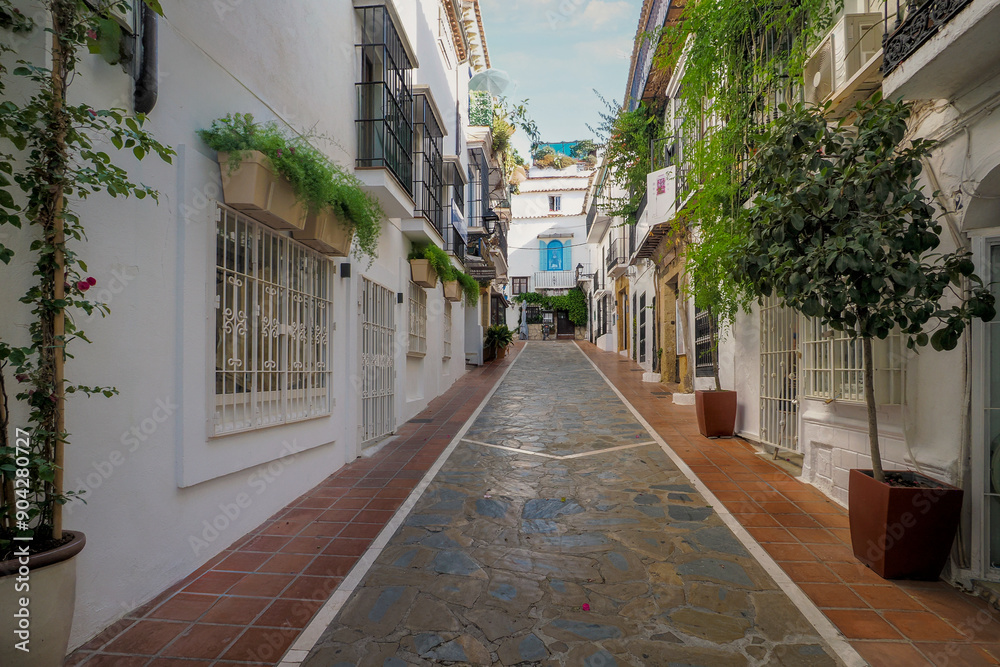 Obraz premium Fragment of the old town of the beautiful town of Marbella - a city located in southern Spain, near Malaga in Andalusia. The photo was taken on June 10, 2024