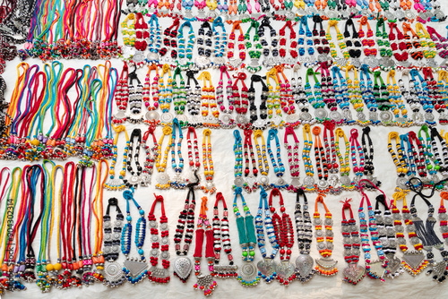 Traditional handmade multicolour fancy satin decorative Mala or necklace with plastic beads, selling at Sonajhuri haat at Shantiniketan, West Bengal photo