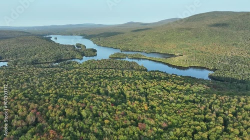 Aerial of Early Season Fall Color Over Remote Northern New England Lake - Norton Pond, Vermont  photo