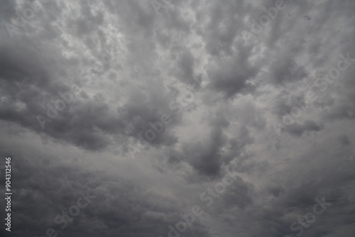Fototapeta Naklejka Na Ścianę i Meble -  Gray clouds in the sky closed the sunlight, black and white shot of gray sky