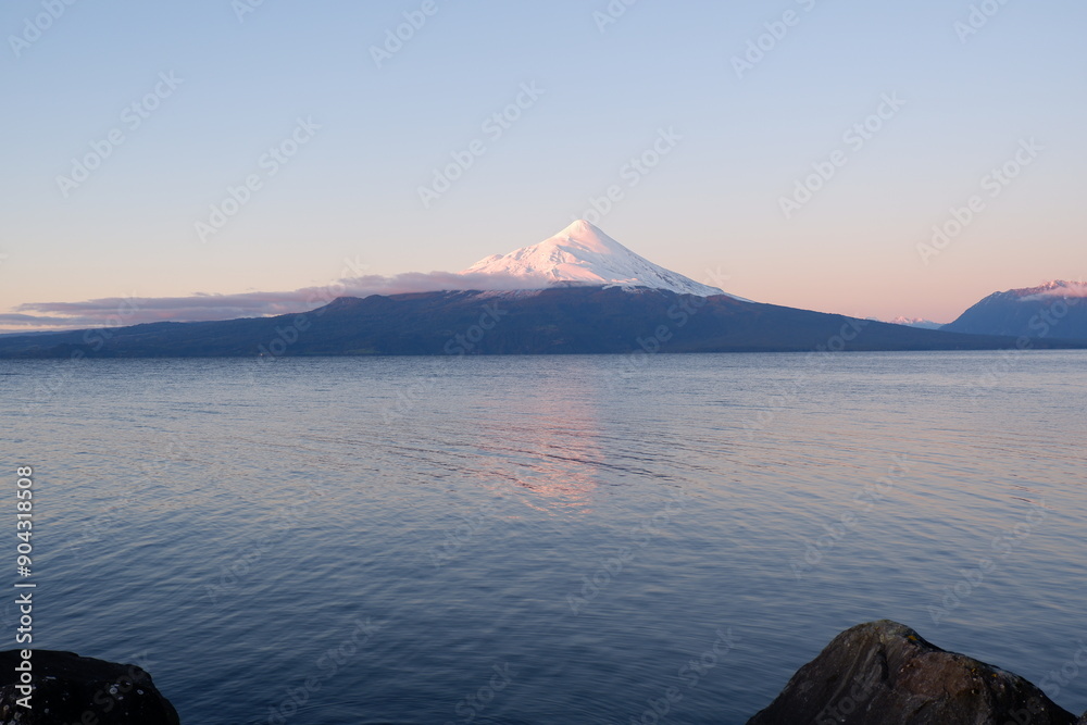 Winter sunset over Lake Llanquihue in the Chilean Lake District with Osorno Volcano in view Winter sunset over Lake Llanquihue in the Chilean Lake District with Osorno Volcano in view
