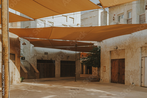 Dubai, UAE - October 5, 2020: Al Fahidi Courtyard Al Bastakiya historical district in Old Dubai with traditional arabic houses and market photo