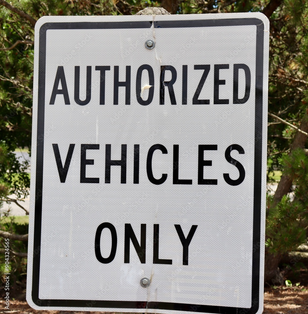 A close view of the black and white metal sign.