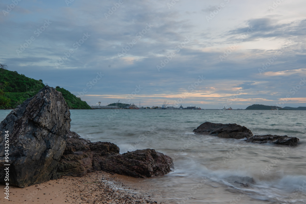 View of Sattahip bay at sunset time. Sattahip bay at sunset time with long exposure photo. View of Sattahip bay at sunset time. Sattahip bay at sunset time with long exposure photo.