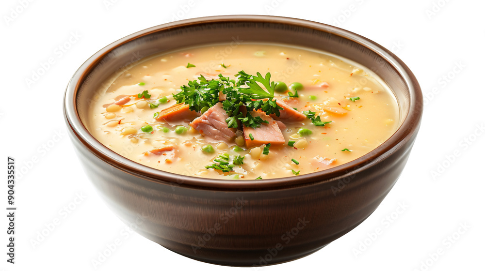 Creamy split pea soup garnished with ham, carrots, peas, and fresh parsley in a wooden bowl Creamy split pea soup garnished with ham, carrots, peas, and fresh parsley in a wooden bowl