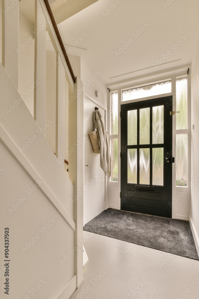 Entryway with stairs and black front door Entryway with stairs and black front door