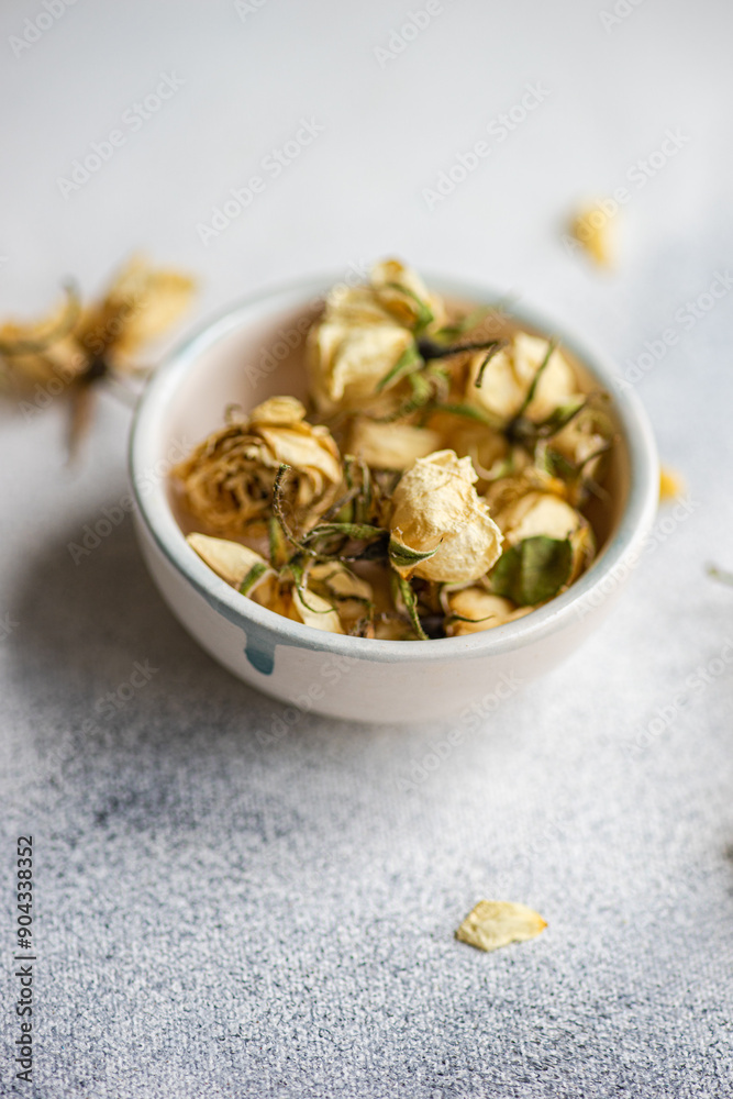 Bowl of dried roses on a soft textured surface Bowl of dried roses on a soft textured surface